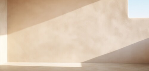 A light beige stucco wall with soft shadows.