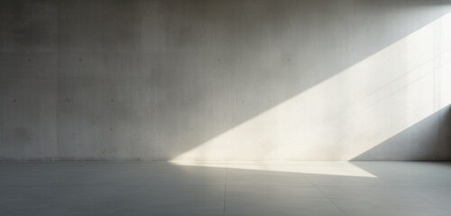 A smooth concrete wall with soft shadows.