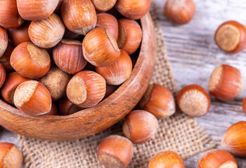 Shelled Hazelnuts is important for health on the wooden background