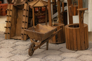 Old wooden wheelbarrow in a workshop to be repaired.
