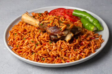 Local Turkish food; Lamb on barley noodle. Turkish name; Ankara Tava or sehriyeli pilav ustu kuzu incik