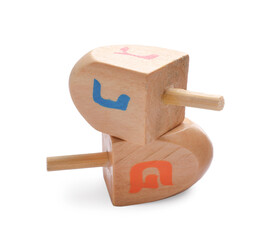 Wooden dreidels isolated on white. Traditional Hanukkah game