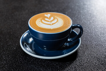 Coffee latte art in blue cup - vintage effect style pictures