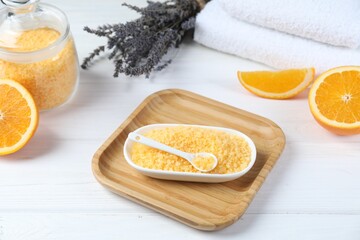 Sea salt, lavender, orange and towels on white wooden table