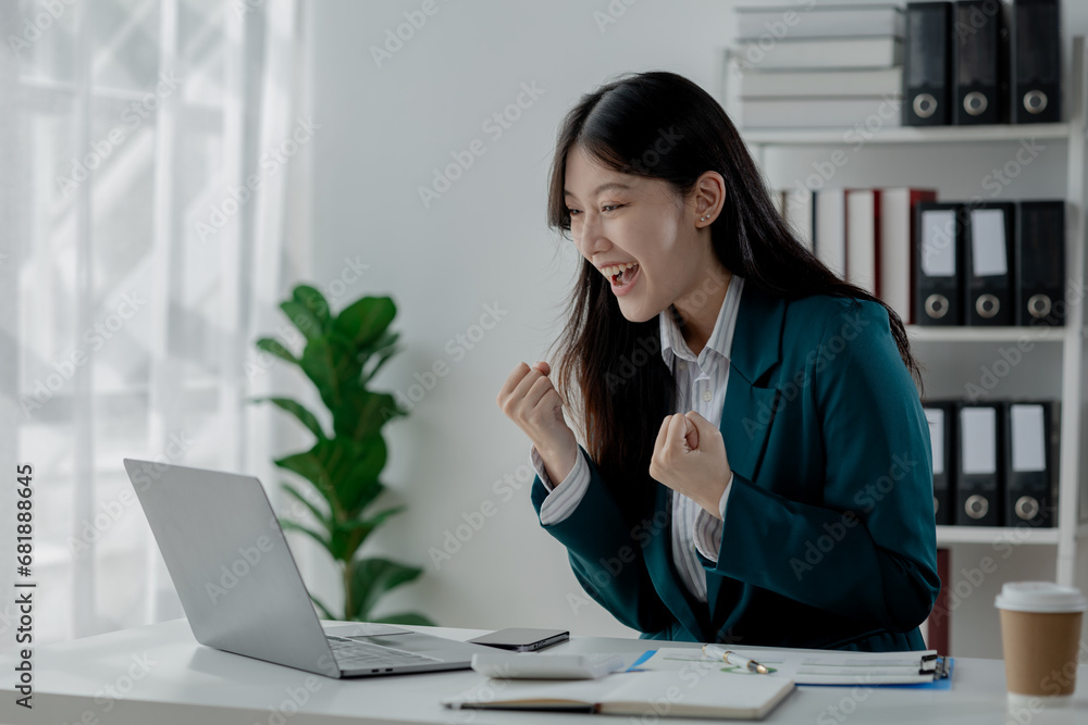 Poster using a laptop to discuss work in the company, presentation of successful work, check email with a s