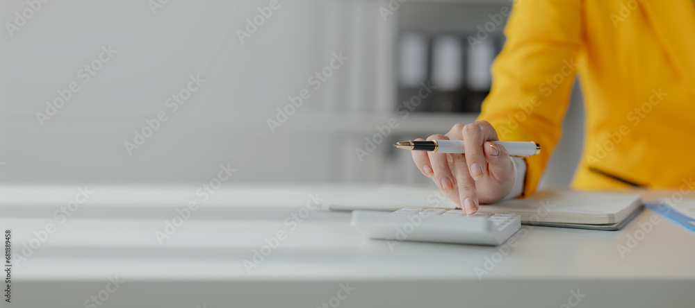 Poster accountant calculating numbers on calculator, auditor is working on accounting in the office, numeri