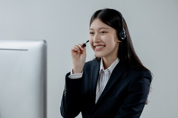 Call center employee talking with customer through headset, The operator is providing customer service by phone, Customer service staff is providing support and helping resolve issues.