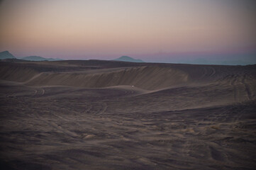 Sunset on the sand dunes, with pastel colors from the last rays of the sun.