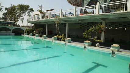 Top view swimming pool with clear water on sunny background