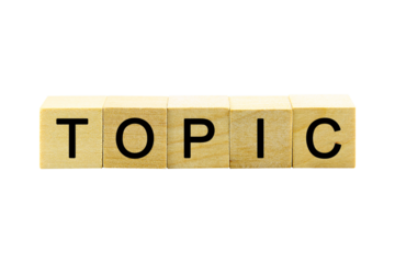 "TOPIC" text or message short word english letter on a small wooden cubes block with white background.