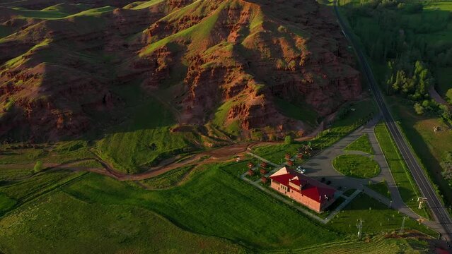 Aerial view of fairy chimneys and rock formations in Narman district of Erzurum province and the social facility next to them