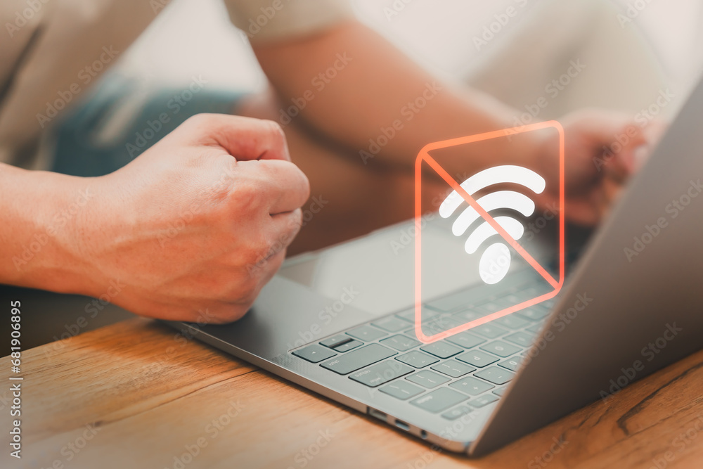 Poster Man using a laptop computer to connect to wifi, but wifi not connected or password is incorrect and waiting to loading digital data form website. Technology concept of wifi connected but no internet.
