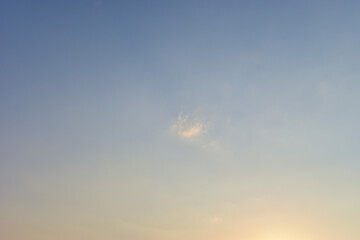 beautiful blue sky and cloud with golden ray sunrise in the morning, natural background