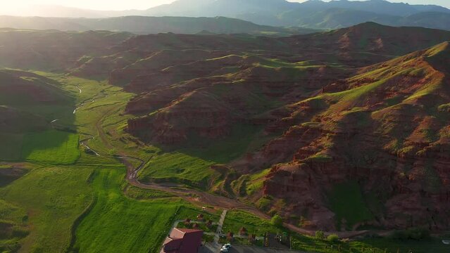 Aerial view of fairy chimneys and rock formations in Narman district of Erzurum province and the social facility next to them
