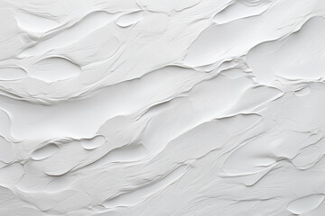 A white textured paint wall with thick layers