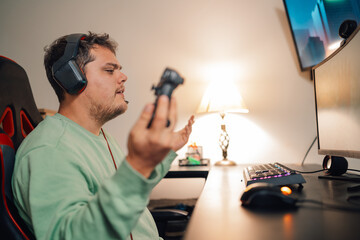 Gamer gesturing upset while playing at home