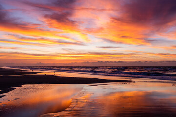 Fototapeta na wymiar Beach Reflections of Colorful Morning Sky