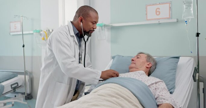 Medical stethoscope and doctor with patient in hospital after surgery, treatment or procedure. Discussion, checkup and African male healthcare worker talk to senior man in clinic bed for diagnosis.
