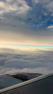 Airplane In the Sky Above The Clouds