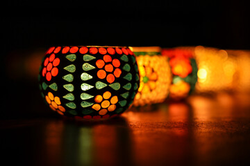 Diwali celebration Indian festival of lights Diya oil lamp lantern. Colors Rangoli decoration...