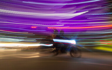 speed motion blur of motorcycle in traffic