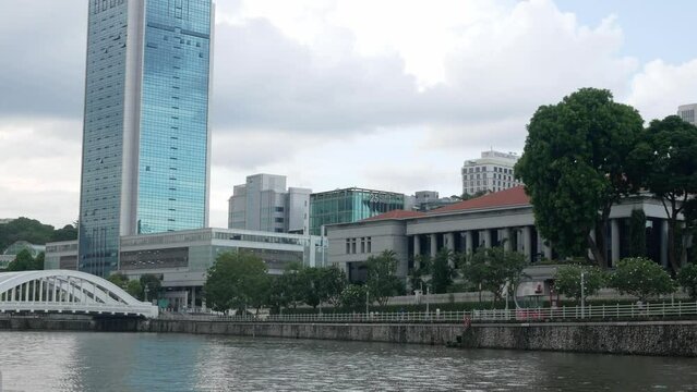 landscape view at clarke quay area, famous nightlife tourist place in Singapore, from cruising in singapore river. Singapore oldtown riverside waterfront view