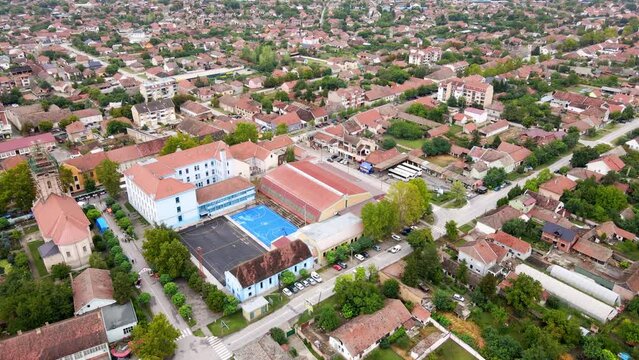 Drone flight above red rooftops in Serbian town Novi Becej