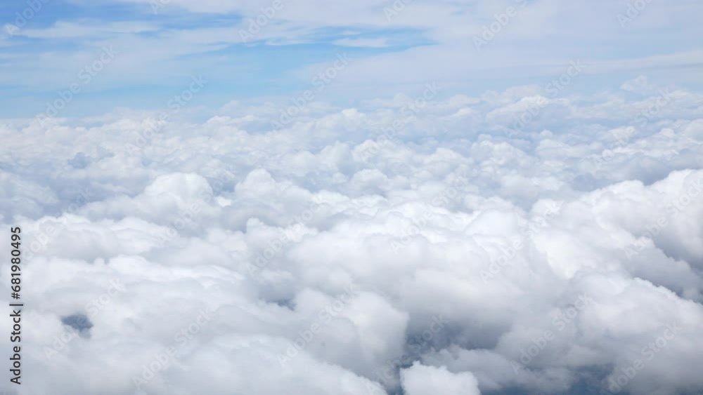 Wall mural blue sky with white fluffy clouds from airplane flight fly over the clouds in a sunny day with cloud