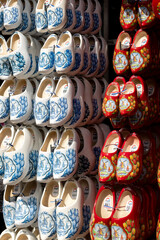 Fototapeta na wymiar Wooden multi-colored shoes clogs in the souvenir shop