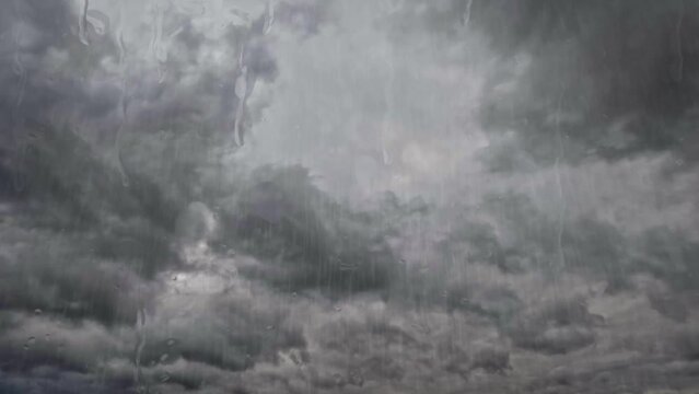 fast timelapse clip with heavy rain and big cold gray clouds