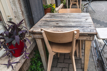 Wooden table and chairs of a street cafe in Istanbul.