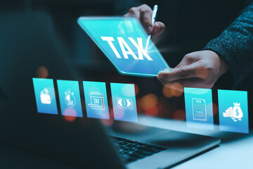 Businesswoman using the laptop to fill in the income tax online return form for payment. Financial research,government taxes and calculation tax return concept. Tax and Vat concept