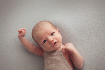 Awake newborn baby boy portrait
