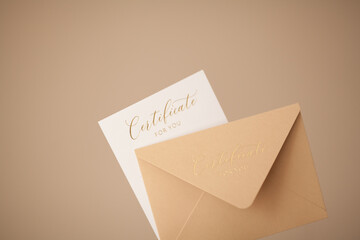 Envelope with a certificate as a gift on a beige background