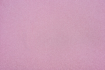 色むらのあるピンクのサテン生地を背景に