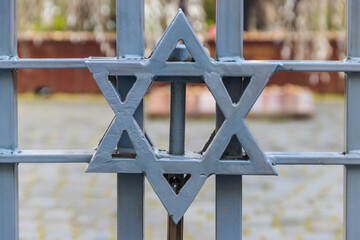 Jewish star of David on the metal fence