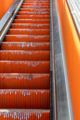 Details of an escalator with aged stairs © jokuephotography