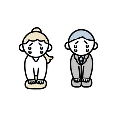 正座で反省する働く男女2人