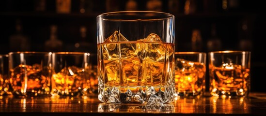 In the shot, a glass of clear whiskey stands isolated on a white background, full to the brim with a amber-colored liquid, inviting the viewer to imagine the taste of this rich bourbon. The shot