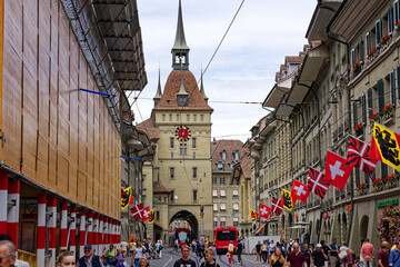 Old town with flags waving at open day of federal mile because of 175 year jubilee of the Swiss...
