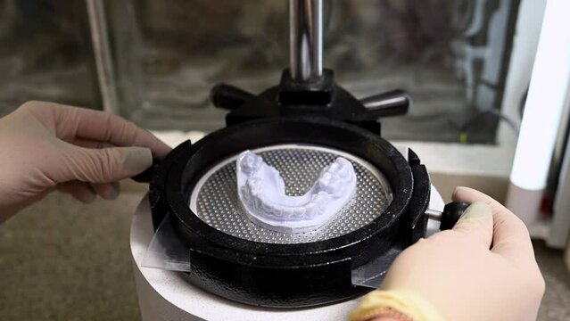 Mouth guard for teeth, printed on a 3D printer in dental clinic laboratory. 4k cinematic slow motion video