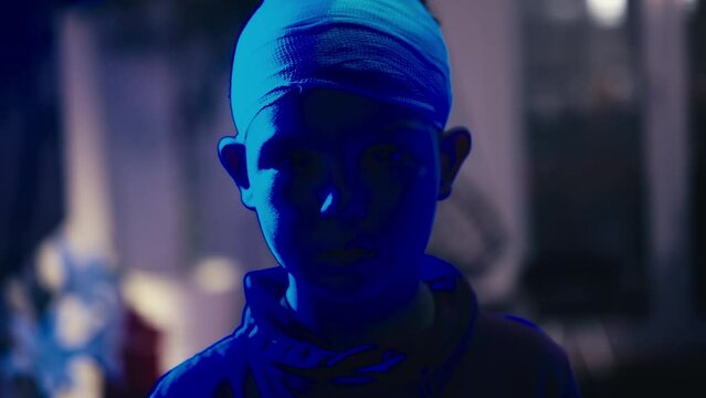 White Caucasian Boy Illuminated in Police Rotation Colors