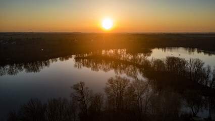 Sunset above river lagoon. Aerial drone view.