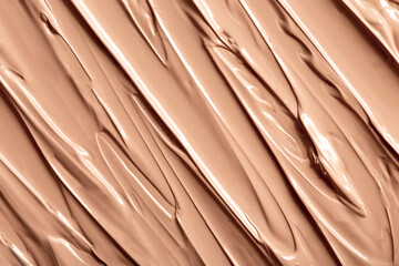 The base of the foundation is smeared as a sample background close-up. Makeup cosmetics. Concealer....