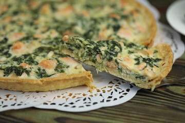 Delicious Quiche pie with salmon fish and pine nuts filling