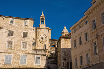 Buildings in Narodni Trg - People’s Square - in the centre of Split okd town, Croatia. Zeljezna Vrata or Iron Gate, Pjaca Clock Tower, and Cyprian's Palace are background centre