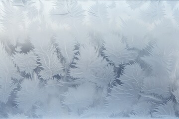 Frosty Window: Close-up of frost patterns on a window with a view of snowy landscapes.