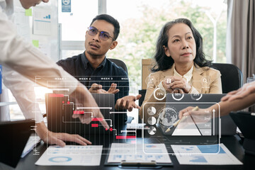 Business team hand project manager working and update tasks and Gantt chart scheduling virtual diagram.with smart phone, tablet and laptop in office.