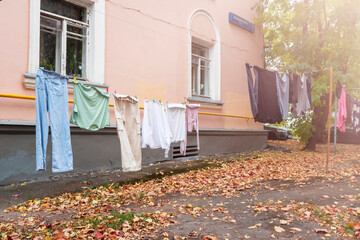 Laundry sleeping on a line on the street.