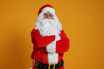 Fototapeta na wymiar Merry Christmas. Santa Claus on orange background